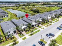 A lovely neighborhood with a stunning pond view and neat lawns gives this home great curb appeal at 661 Drop Shot Dr, Davenport, FL 33896