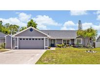 Charming single-story home with a two-car garage and a well-manicured lawn at 6396 Bennett Ct, St Cloud, FL 34771