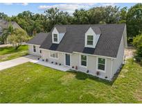 Charming home featuring a well-manicured lawn, a classic roofline, and a welcoming entrance at 1158 Stroupe Rd, Kissimmee, FL 34744