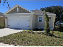 Charming single-Gathering home with a two-car garage and well-manicured lawn at 1370 Holodak Dr, Davenport, FL 33837