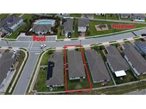 Aerial view of a single-Gathering home in a well-maintained community, near a community pool and playground at 3839 Marbella Way, Davenport, FL 33897