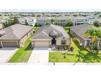 Lovely single Gathering home featuring a well-manicured lawn, two-car garage, and neutral color palette at 4928 Cortland Dr, Davenport, FL 33837