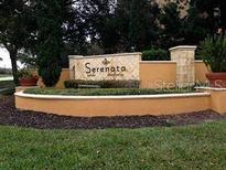 Well-maintained community sign surrounded by lush landscaping at 6137 Metrowest Blvd # 308, Orlando, FL 32835