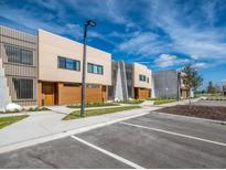 Modern townhomes with neutral colors and wood accents are available, offering contemporary living with ample parking at 5573 Torino Rd, Kissimmee, FL 34746