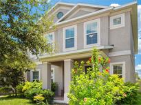 Charming two-story home with well-maintained landscaping and a welcoming front porch at 7266 Desert Mandarin St, Winter Garden, FL 34787