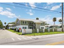 Charming two-story condo with well-maintained landscaping and signage at 840 Molat Square at 840 Center Ave # 80, Daytona Beach, FL 32117