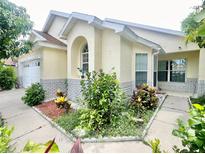 Charming single-Gathering home with lush landscaping and a welcoming front entrance at 162 Seneca Point Trl, Kissimmee, FL 34746