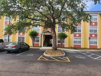 Well maintained apartment building with private parking and manicured landscaping at 3502 Windy Walk Way # 2-308, Orlando, FL 32837