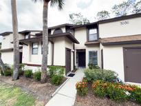 Charming townhome featuring well-maintained landscaping, and a welcoming entryway at 3006 S Semoran Blvd # H-3, Orlando, FL 32822
