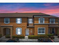 Inviting two-story townhome featuring a well-maintained exterior and a charming entryway at 2708 Camaro Dr, Kissimmee, FL 34746