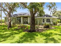 Charming single-story home with a well-manicured lawn and mature trees in a tranquil setting at 5204 Hammock Pointe Ct, St Cloud, FL 34771