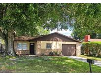 Charming one-story home with a stone accent and mature tree in the front yard at 141 Varner Sw Dr, Winter Haven, FL 33880