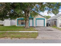 Charming single-story home with a well-maintained lawn, and a one car garage at 1506 Brookebridge Dr, Orlando, FL 32825