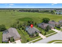 Beautiful aerial view of home, pool, and surroundings at 1525 Gants Cir, Kissimmee, FL 34744