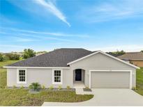 Charming single-story home featuring a well-manicured lawn and attached garage, perfect for suburban living at 549 Viceroy Ct, Kissimmee, FL 34758
