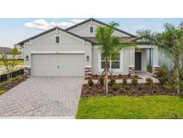 Attractive one-story home with a two-car garage and landscaped front yard at 4837 Foxglove Cir, Lakeland, FL 33811