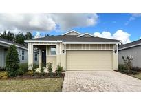 Charming single-story home features a two-car garage, neutral paint, and well-manicured landscaping at 4083 Nw 44Th Cir, Ocala, FL 34482
