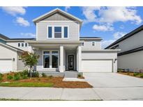 Charming two-story home with a manicured lawn, neutral siding, and a covered front entry for curb appeal at 3051 Bootlace Way, St Cloud, FL 34771