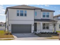 Charming two-story home with a two-car garage and well-maintained landscaping at 4432 Sw 84Th Street Rd, Ocala, FL 34476