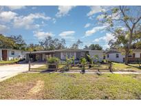 Gray house with a wooden fence and landscaped yard at 1284 Vanderbilt Dr, Ormond Beach, FL 32174