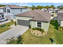 Charming one-story home with a well-maintained lawn and two-car garage at 4310 Trotters Way, Lakeland, FL 33801