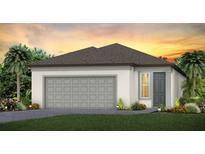 One-story home with gray garage door and landscaping at 5813 Sw 87Th Court Rd, Ocala, FL 34481