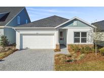 New construction home, one-story, gray and white exterior at 5938 Bristle Oak St, Mount Dora, FL 32757