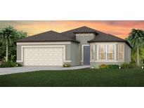 Single-story home with neutral siding, two-car garage, and landscaped lawn at 4464 Sw 84Th Street Rd, Ocala, FL 34476