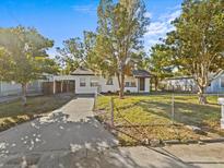 Charming white house with a landscaped yard and driveway at 1321 Mitchell St, Lakeland, FL 33801