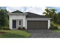 One-story home with a two-car garage and landscaping at 6244 Sw 96Th Pl, Ocala, FL 34476
