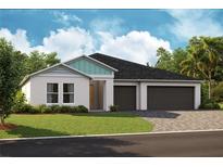 Two-car garage, attractive curb appeal, and landscaping at 6224 Sw 95Th Pl, Ocala, FL 34476