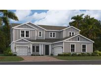 Two-story home with gray siding, two-car garage, and landscaping at 1943 Rider Rain Ln, Apopka, FL 32703