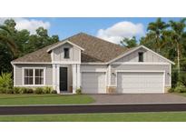 Two-story home with three-car garage and landscaped lawn at 1955 Rider Rain Ln, Apopka, FL 32703