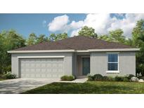 One-story home with gray siding and two-car garage at 1924 Rosewood Cir, Lakeland, FL 33810