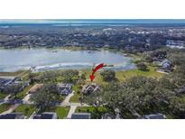 Aerial view showcasing the property's lakefront position at 958 Lake Deeson Pt, Lakeland, FL 33805