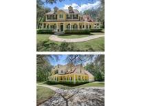 Two-story house with wrap-around porch, and landscaped yard at 4200 Joslyn Ln, Lady Lake, FL 32159