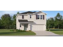 Two-story house with beige siding, gray roof, and a two-car garage at 858 Hour Glass Rd, Lakeland, FL 33801