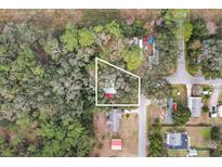 Aerial view showing home's location on a tree-lined street at 11730 Sw 230Th Avenue Rd, Dunnellon, FL 34431