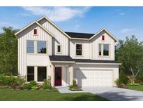 Two-story farmhouse-style home with white siding, red door, and a two-car garage at 16959 Cedar Valley Cir, Clermont, FL 34711