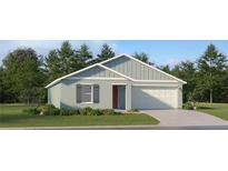 Single story home with a light blue exterior and a two-car garage at 4212 Singing Mockingbird Blvd, Bartow, FL 33830