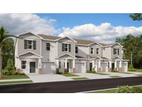 New townhome community with 3-unit buildings, 2-car garages, and attractive landscaping at 2951 Prosperity Way, Clermont, FL 34714