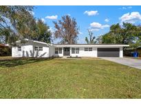 Newly renovated home with modern facade and spacious lawn at 1640 Sylvester Rd, Lakeland, FL 33803