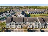 Aerial view of townhouses with parking at 305 Captiva Dr, Davenport, FL 33896