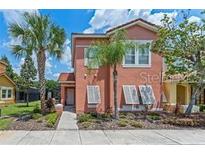 Attractive two-story townhome with a charming front porch at 4753 Vero Beach Pl, Kissimmee, FL 34746