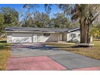 Ranch-style home with attached garage and spacious yard at 5525 Tillman Rd, Lakeland, FL 33810