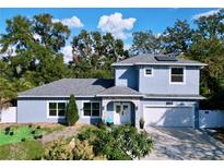 Charming two-story home with well-manicured lawn and a two car garage at 3911 Auburndale Ave, Orlando, FL 32839