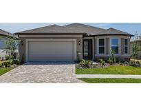 Charming single-story home with a paved driveway, well-maintained lawn, and neutral-colored stucco at 5295 Sw 87Th Ter, Ocala, FL 34481