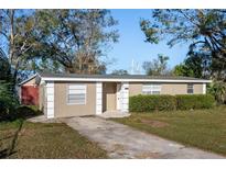 Cozy single-story home featuring a well-maintained lawn and a private driveway, blending comfort with simple suburban living at 6317 Georgia Ave, Lakeland, FL 33813