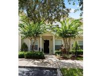 Charming home featuring a welcoming front porch, meticulously maintained landscaping, and a private entrance at 2952 Lucayan Harbour Cir # 102, Kissimmee, FL 34746