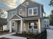 Charming two-story home featuring a covered front porch and well-maintained landscaping at 1630 Haven Dr, Orlando, FL 32803